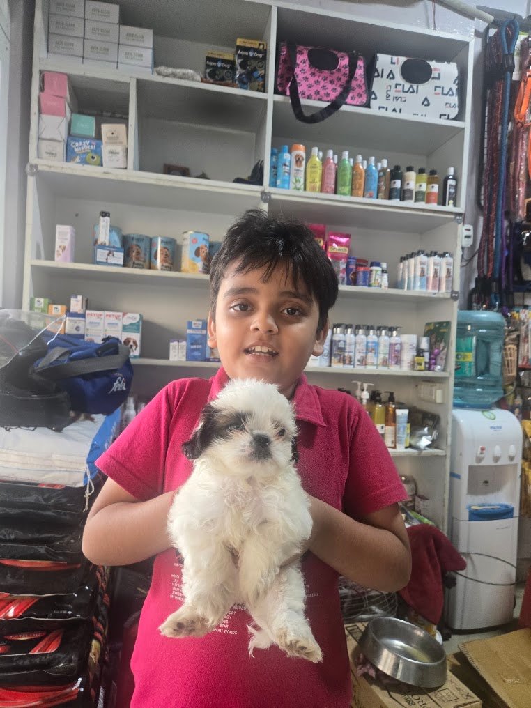 Happy family with their new pet from VS Pet Shop Noida