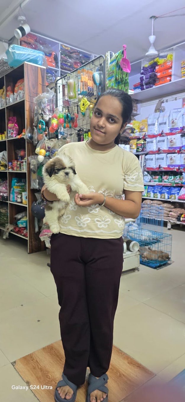 Happy family with their new pet from VS Pet Shop Noida